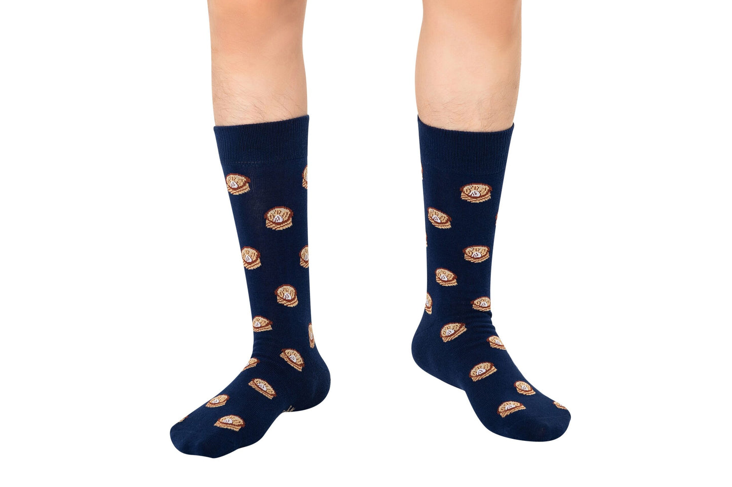 A person wears knee-high navy blue Dumpling Socks – Fun & Cozy Gift for Food Lovers with a playful donut pattern, standing on a white background.