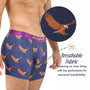 A man wears Flying Eagle Underwear—blue boxers with an eagle print and a purple waistband, perfect for wildlife fans. An inset shows small perforations in the moisture-wicking fabric, emphasizing their breathable inner lining.