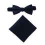 A display of timeless elegance, the Dark Forest Navy Cotton Bow Tie & Pocket Square Set graces a plain white background.
