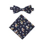 The Floral Navy Yellow Cotton Bow Tie & Pocket Square Set features a cotton design with dainty white, orange, and yellow flowers.