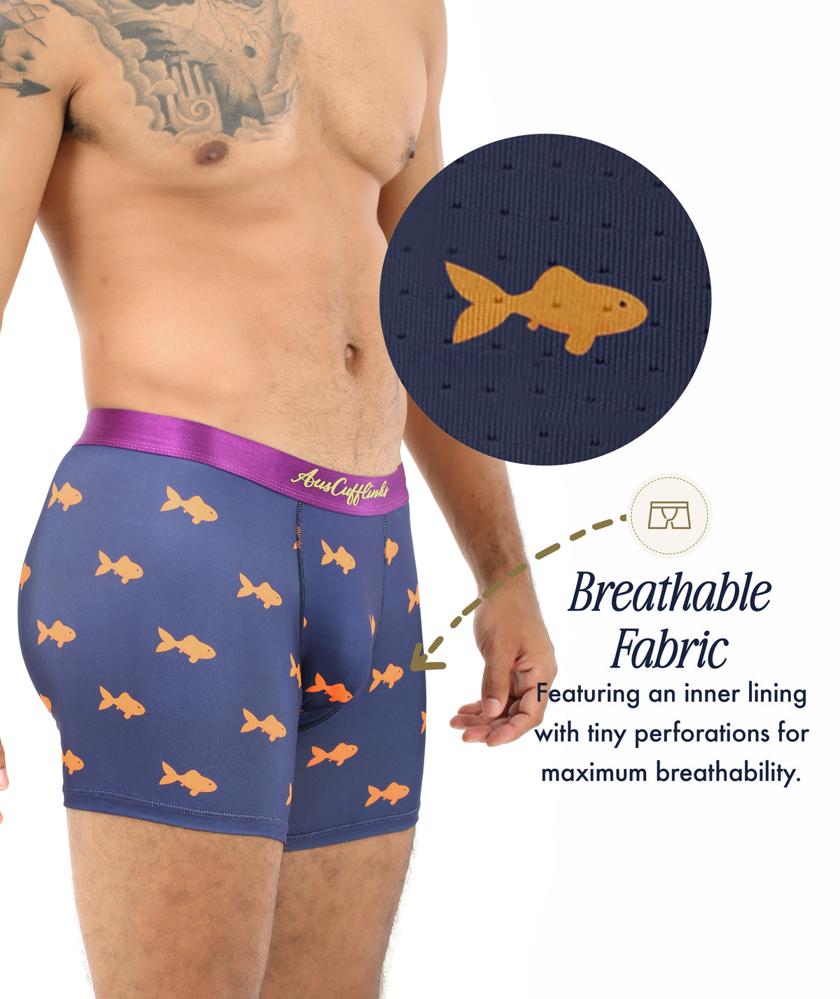 A man models Goldfish Underwear: navy boxers with orange fish print and a purple waistband; inset displays close-up of tiny perforations, highlighting the breathable, moisture-wicking fabric ideal for quirky style fans.
