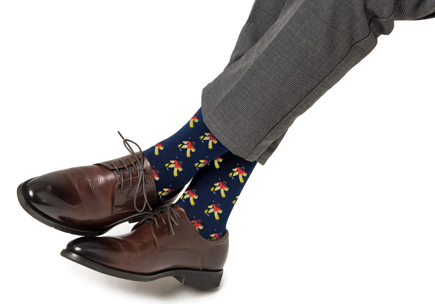 A person wearing gray suit pants, brown dress shoes, and Ice Hockey Goalie Socks featuring a colorful parrot pattern for pro-level comfort and breathable durability.