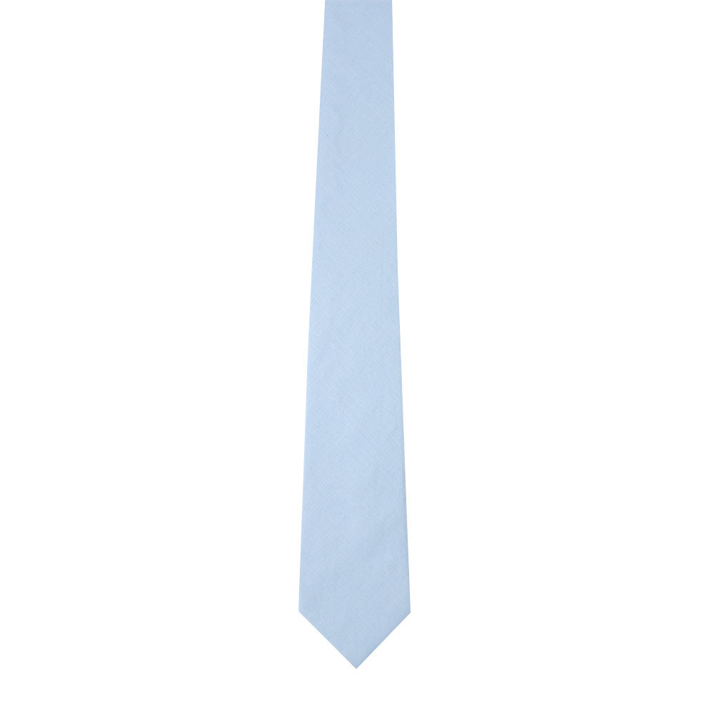 A light blue cotton skinny tie, part of a pocket square set, rests gracefully on a white background, embodying a timeless style.