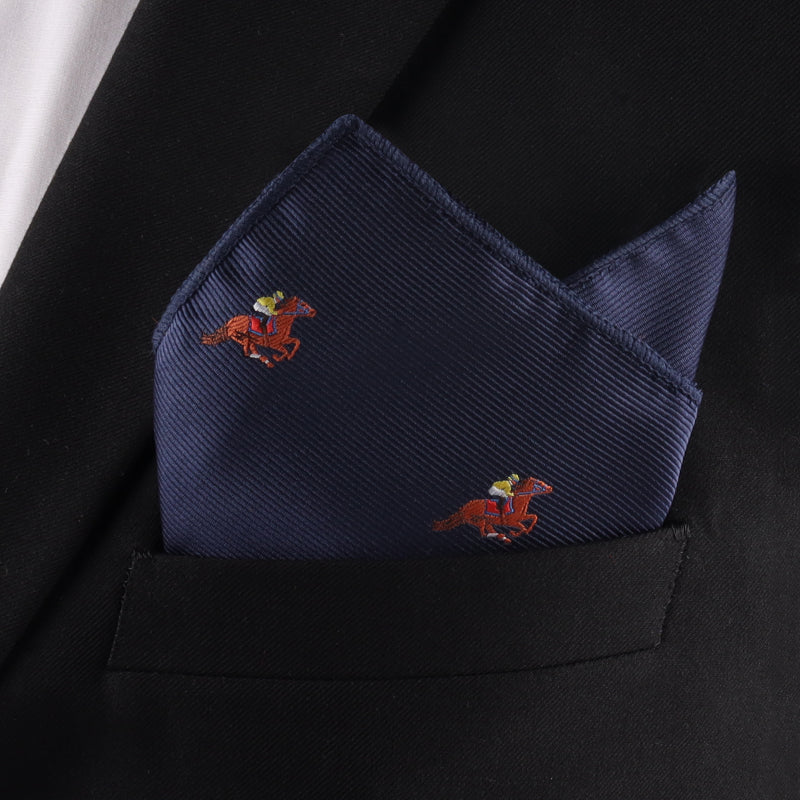 The Melbourne Race Horse Pocket Square in navy blue, featuring embroidered jockeys and horses, adds a stylish touch to any black suit jacketâperfect as a Melbourne Cup accessory.