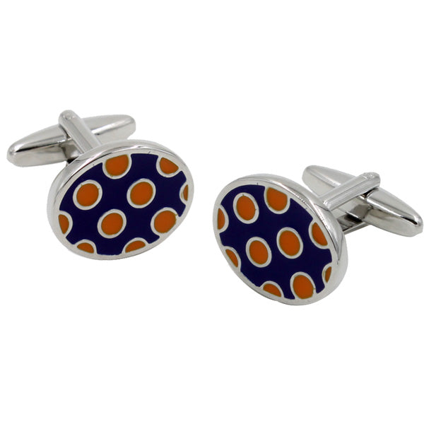 The Ladybug Orange Navy Cufflinks feature a sleek silver base with a dark blue face adorned with orange and white polka dots, offering a blend of classic elegance and contemporary flair for the modern gentleman.