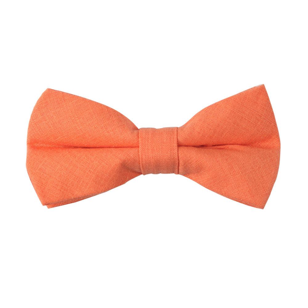 Embrace spring with the Peach Orange Cotton Bow Tie & Pocket Square Set, featuring a sophisticated peach-orange bow tie against a white background. Ideal for adding charm to any event.
