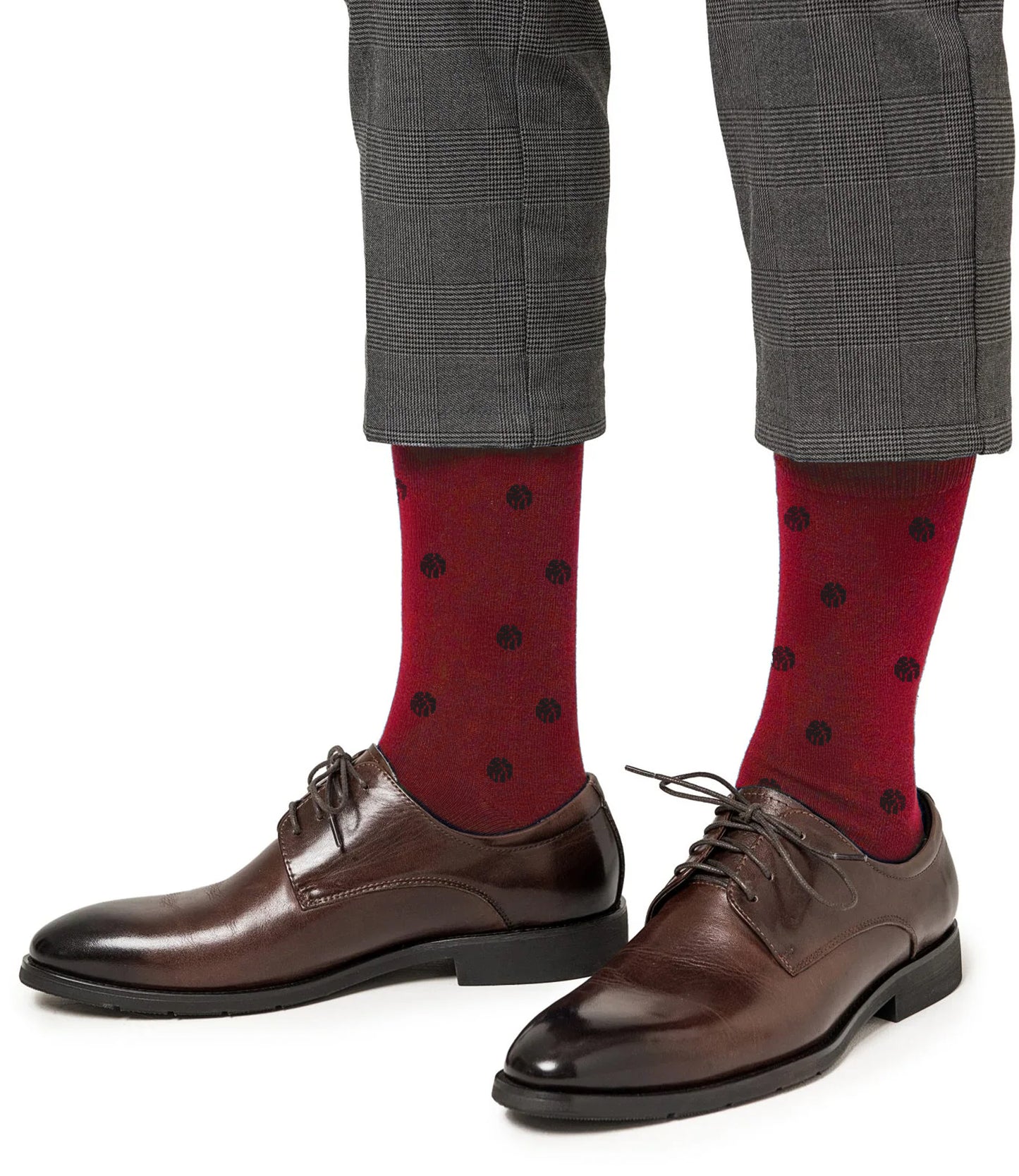 A person wearing brown dress shoes, Blue Basketball Socks for cushioned support, and gray plaid pants.