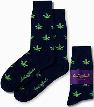 Weed Socks—navy blue with green cannabis leaf patterns and “AusCufflinks” branding, displayed both unfolded and packaged—make a playful gift for motorsport enthusiasts.