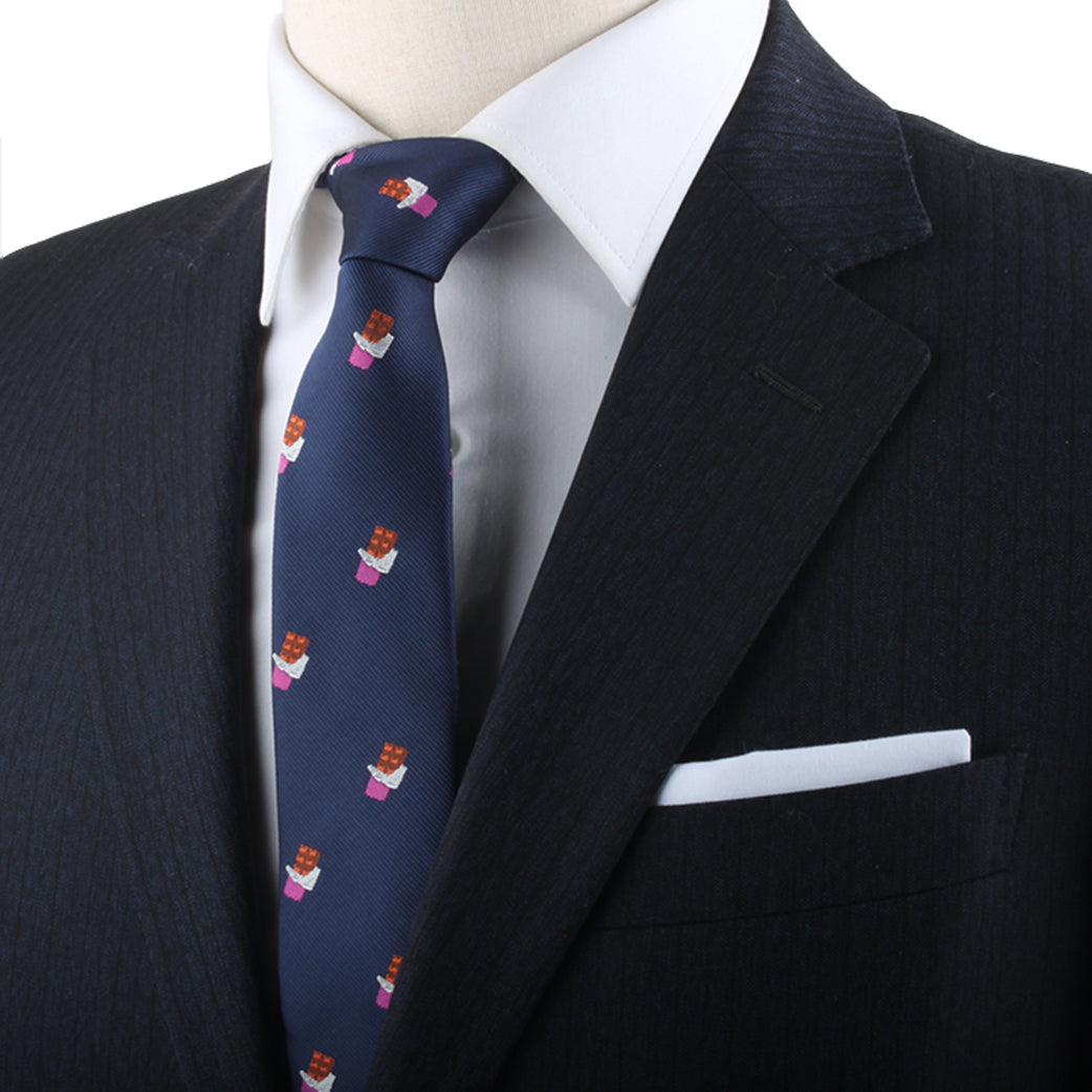 A mannequin exuding timeless elegance in a suit with a Chocolate Skinny Tie.