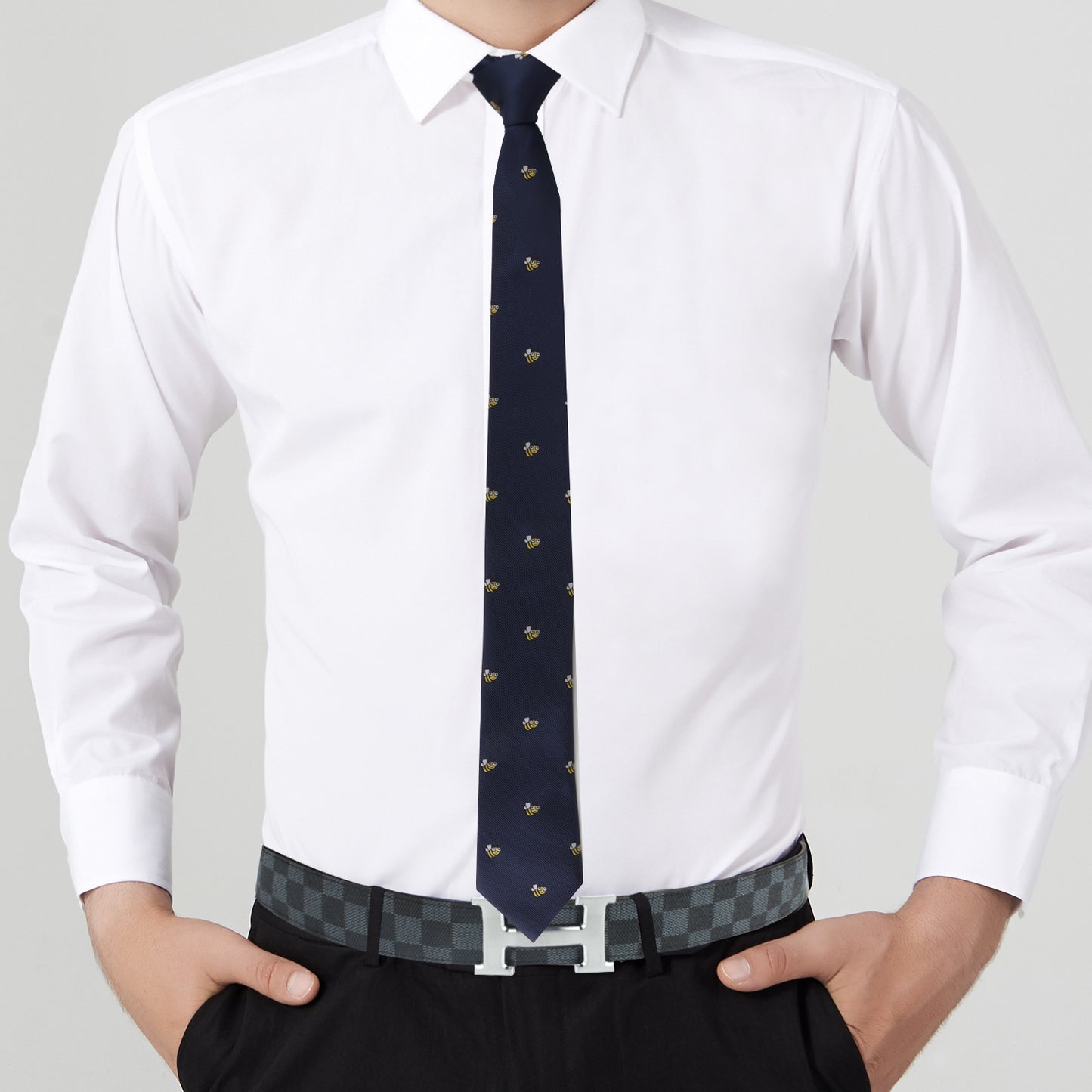 A stylish man wearing the Bee Skinny Tie and white shirt.