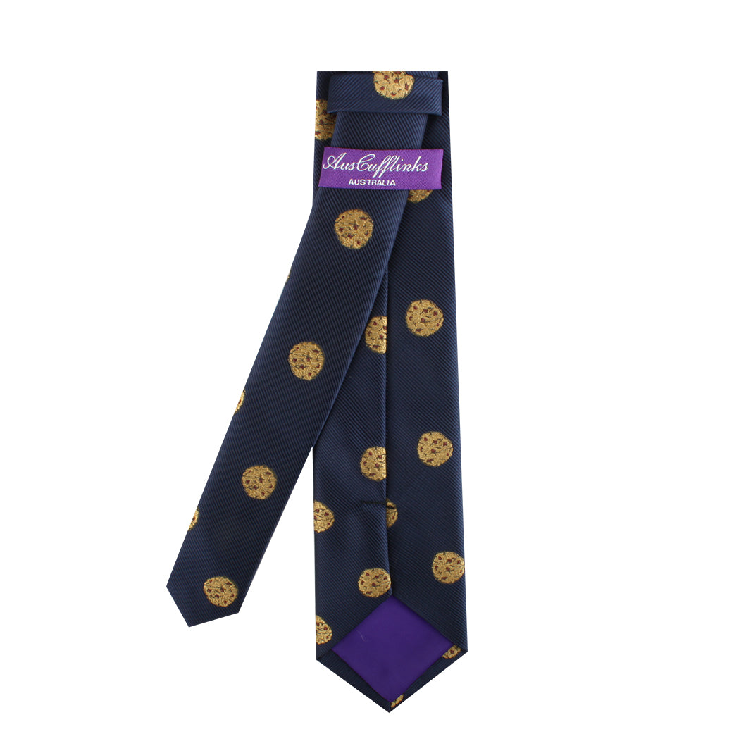 A Cookies Skinny Tie with timeless style and gold circles on it.