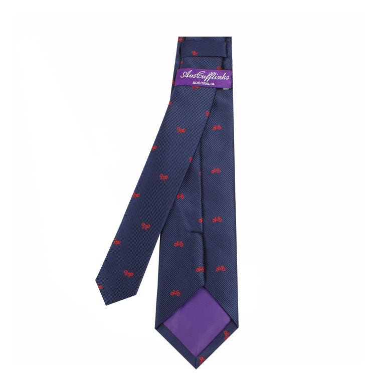 A Cyclist Skinny Tie with a red and blue bow featuring a cycling-themed pattern.