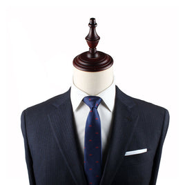 A suit and the Cyclist Skinny Tie on a mannequin dummy.