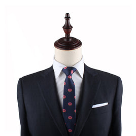 Mannequin displaying engaging style with navy suit, Donut Skinny Tie, and pocket square.