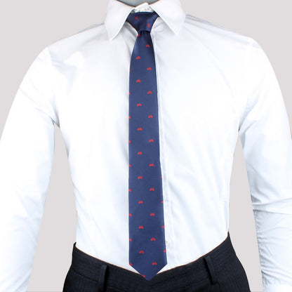 A mannequin wearing a Cyclist Skinny Tie and white shirt with a Cycling-themed pattern.