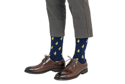 A man wearing a pair of Duck socks.
