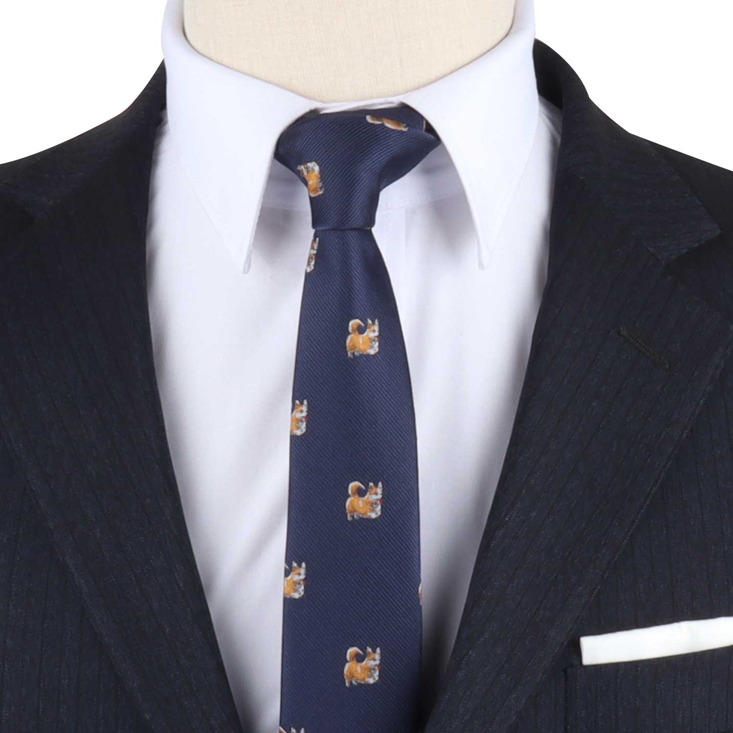 A mannequin wearing a Corgi Dog Skinny Tie with a feline charm on it.