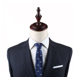Navy suit and Swimming Skinny Tie, evoking timeless style, displayed on a mannequin torso.