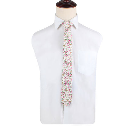 A mannequin wearing a Cream Floral Skinny Necktie and Pocket Square Set, showcasing elegance.