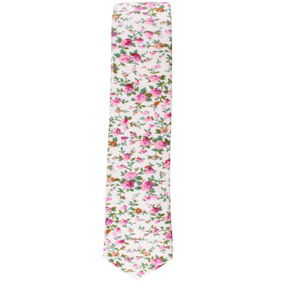 A cream floral skinny necktie and pocket square set on an elegant background.