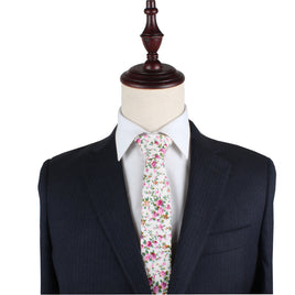 A suit with a Cream Floral Skinny Necktie and Pocket Square Set on a mannequin dummy.