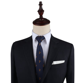A mannequin dressed in a navy suit, white shirt, Harp Skinny Tie, and a pocket square, orchestrated with elegance against a plain background.