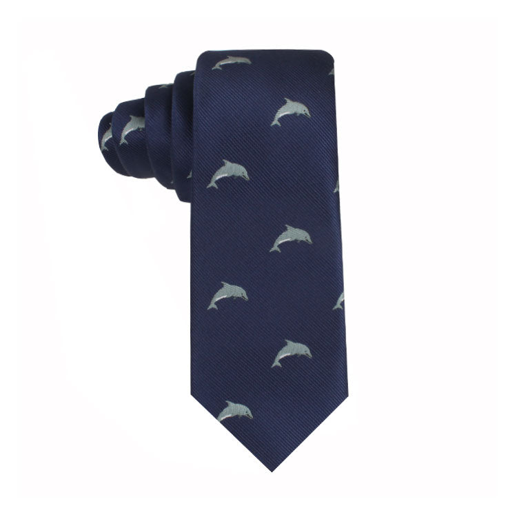A Dolphin Skinny Tie featuring a dolphin-inspired design with a pattern of small white dolphins, perfect for ocean enthusiasts.