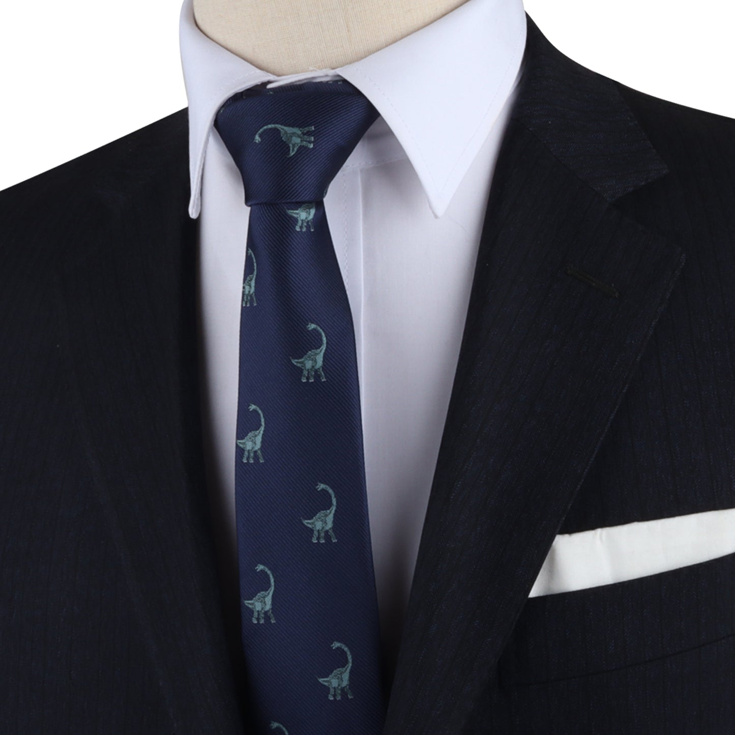 A mannequin dressed in a suit with a Brontosaurus Skinny Tie and pocket square, exuding elegance.