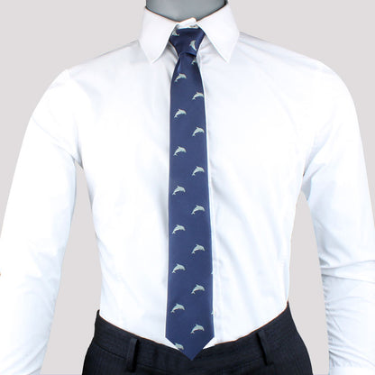 Mannequin dressed in a white dress shirt with a Dolphin Skinny Tie, perfect for ocean enthusiasts, paired with dark trousers.