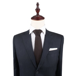 A Brown Knitted Skinny Tie on a mannequin.