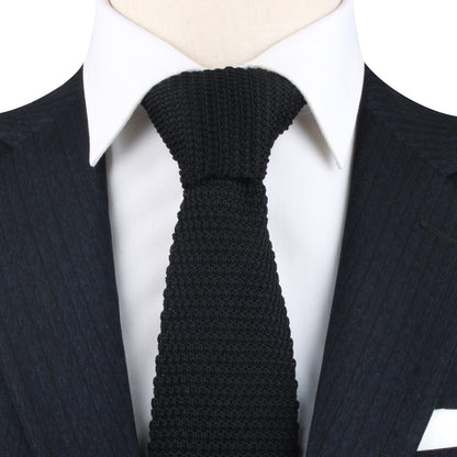 A classic Black Knitted Skinny Tie on a mannequin.