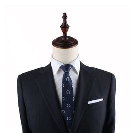A Headphone Skinny Tie mannequin dummy dressed in a suit and tie exudes contemporary elegance.
