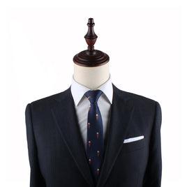 Mannequin torso showcasing a dark suit, white shirt, Ice Cream Skinny Tie, and handkerchief against a white background.
