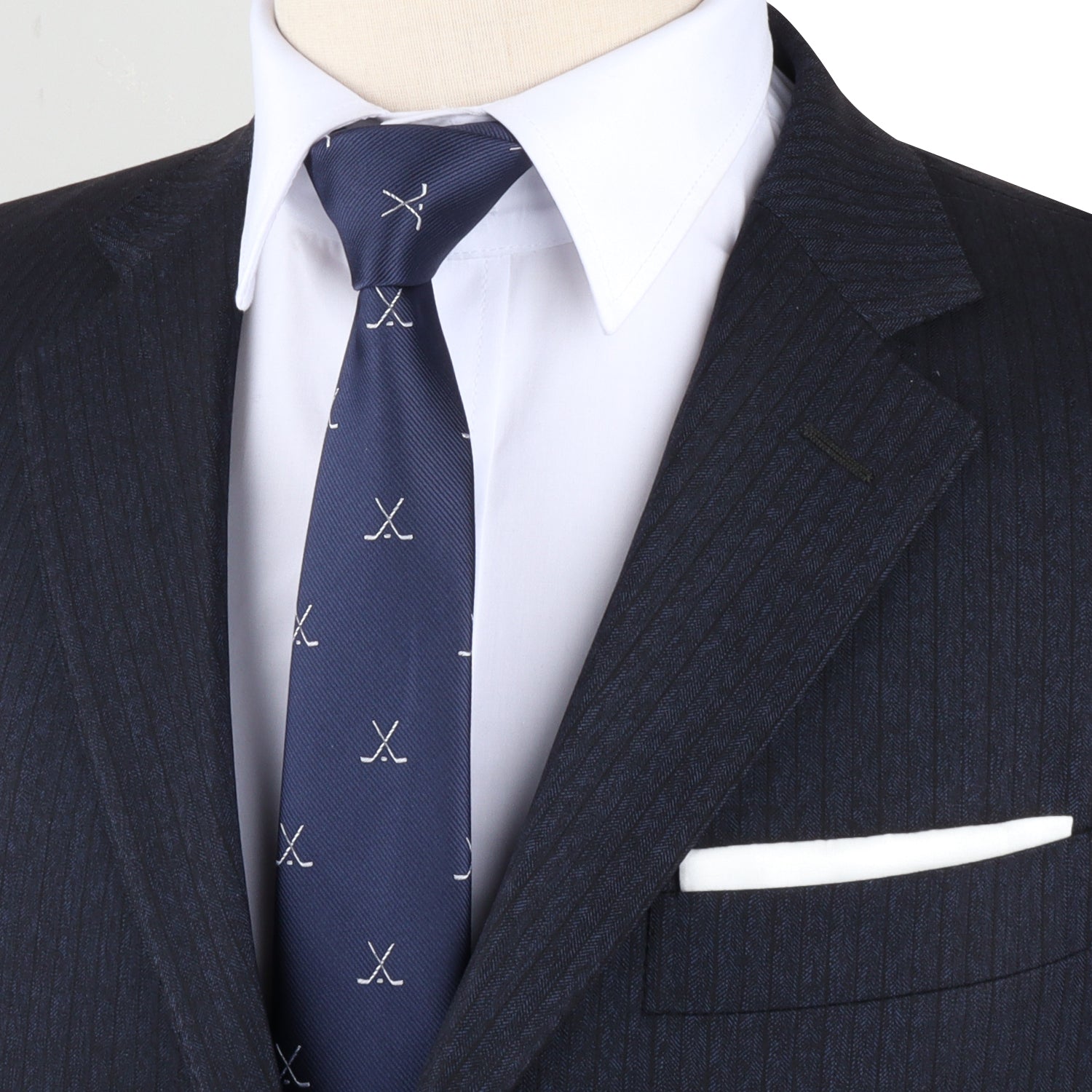 A mannequin wearing a stylish blue suit and Crossed Ice Hockey Skinny Tie, earning high style points.