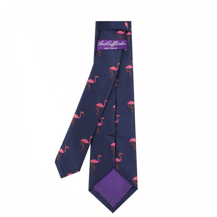 Navy blue Pink Flamingo Skinny Tie, embodying tropical elegance and a purple tail, labeled "just flamingos, made in Italy.