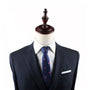 Mannequin displaying a navy suit, Pink Flamingo Skinny Tie, and pocket square that stands out, against a plain background.
