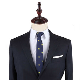 A suit with a Camel Skinny Tie and pocket square on a mannequin, exuding urban elegance.