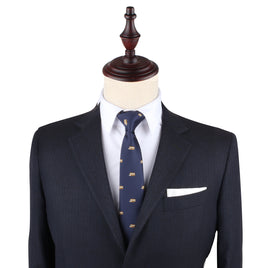 A charming mannequin donning a suit with a School Bus Skinny Tie.