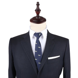 A luxe blue suit with a Cash Skinny Tie on a mannequin.