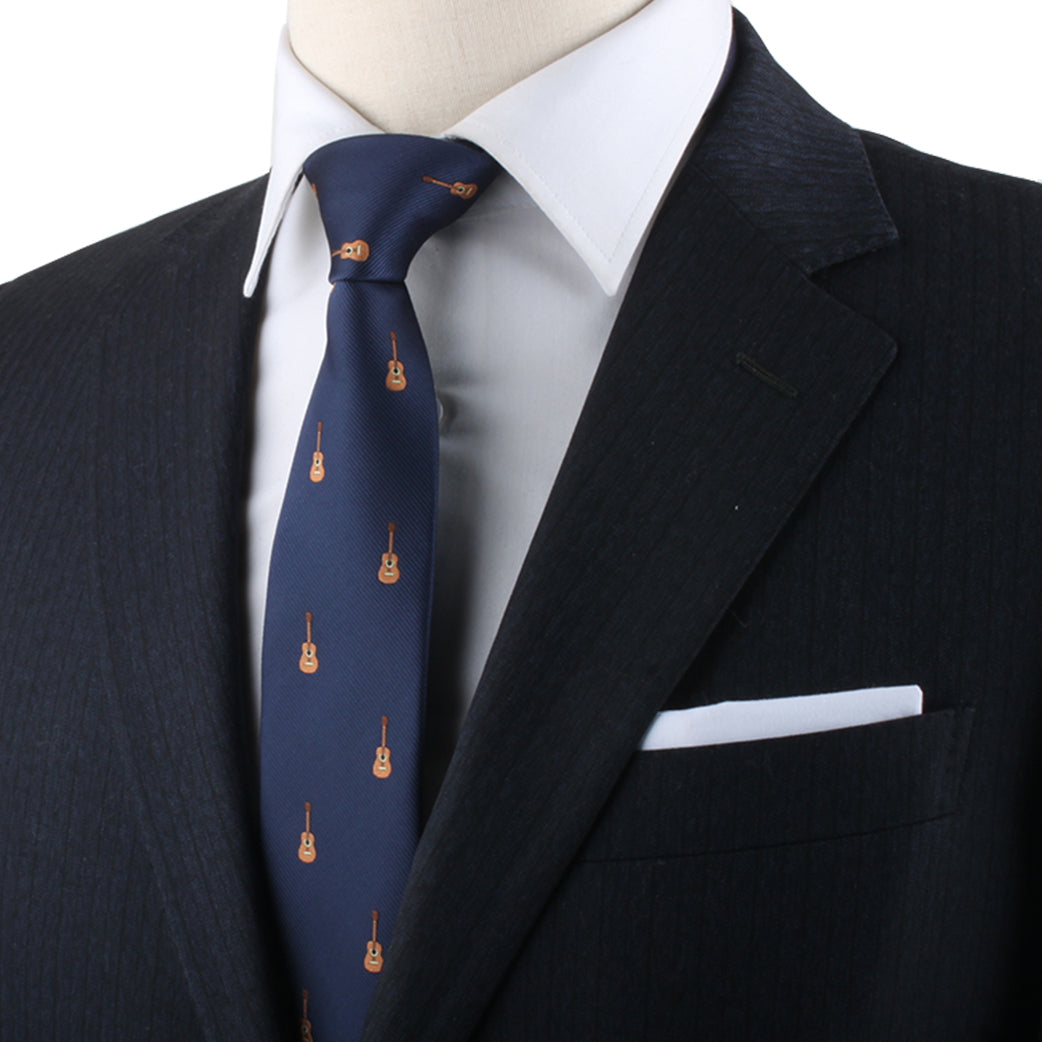 Close-up of a mannequin dressed in a dark suit with a white shirt and a Acoustic Guitar Tie expressing melodic passion through guitar patterns.
