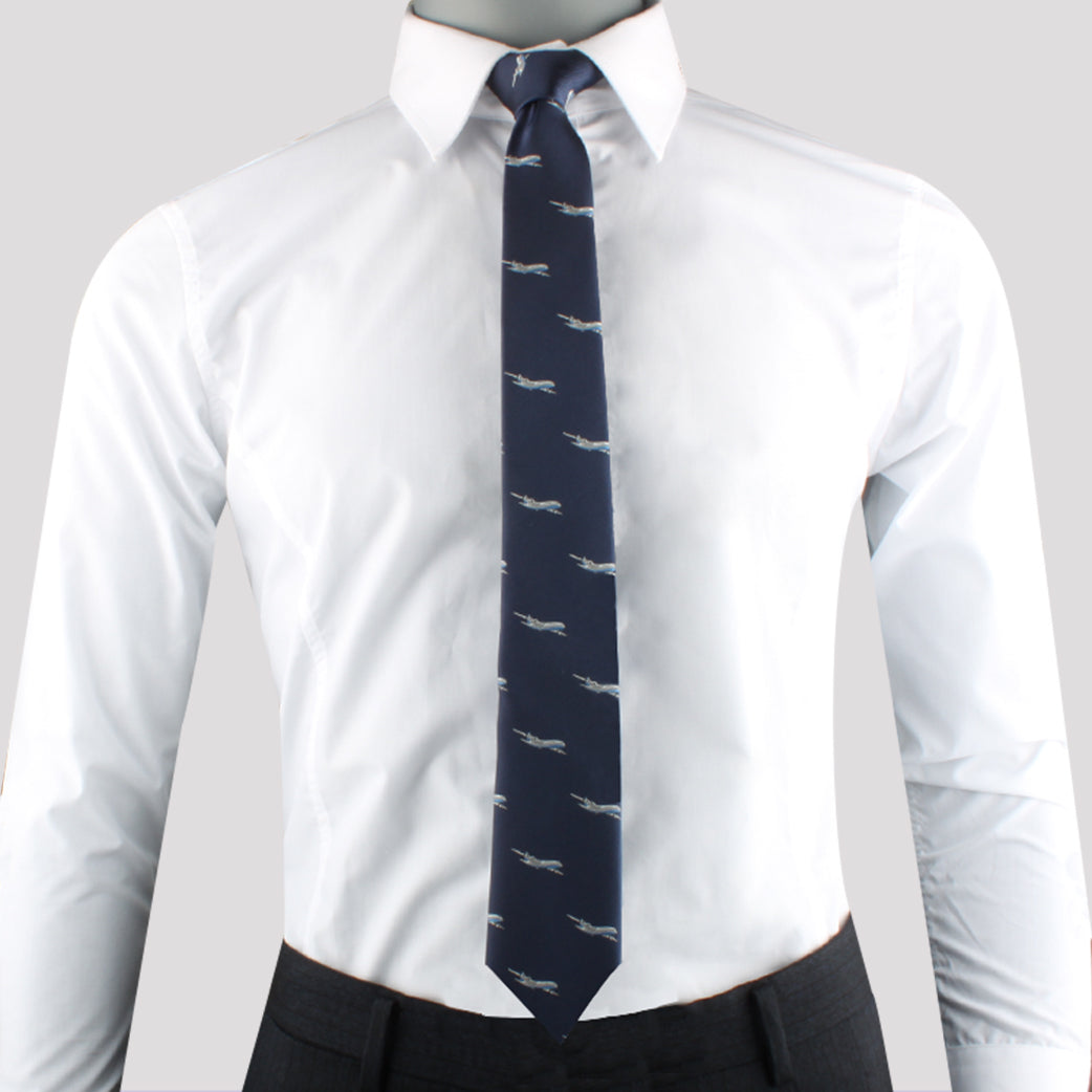 Person exuding charm in a white dress shirt and an Aviation Skinny Tie.