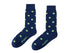 A pair of Apple Socks with green polka dots.