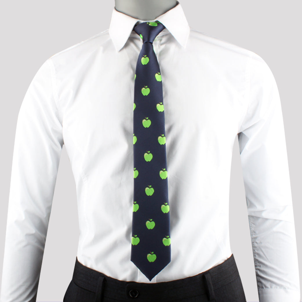 A person wearing a white dress shirt, an Apple Pattern Tie, and grey pants effortlessly combines modern style with natural freshness.