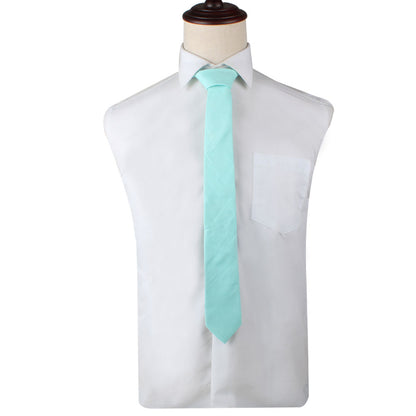 A mannequin wearing a cool Aqua Skinny Necktie and Pocket Square Set.