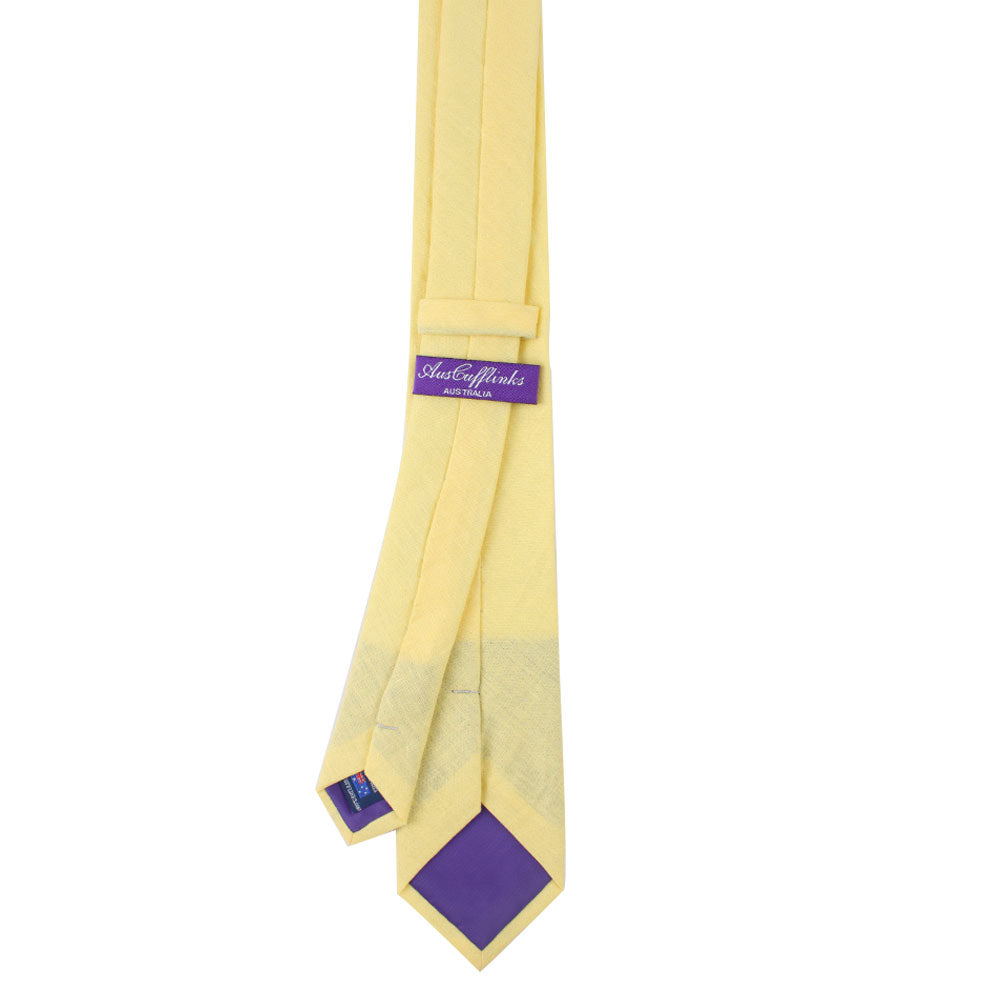 Baby Yellow Skinny Cotton Tie with a purple inner lining and branding label.