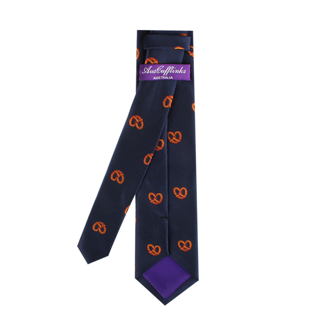Bagel Print Tie with an orange pretzel pattern, offering a touch of culinary delight. Featuring a purple label with the text "Australian," this accessory combines contemporary style with playful design.