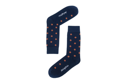 A pair of basketball socks with orange dots.