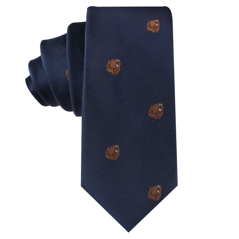 The Grizzly Bear Skinny Tie in dark blue, adorned with small brown motifs, exudes sophistication and untamed allure.