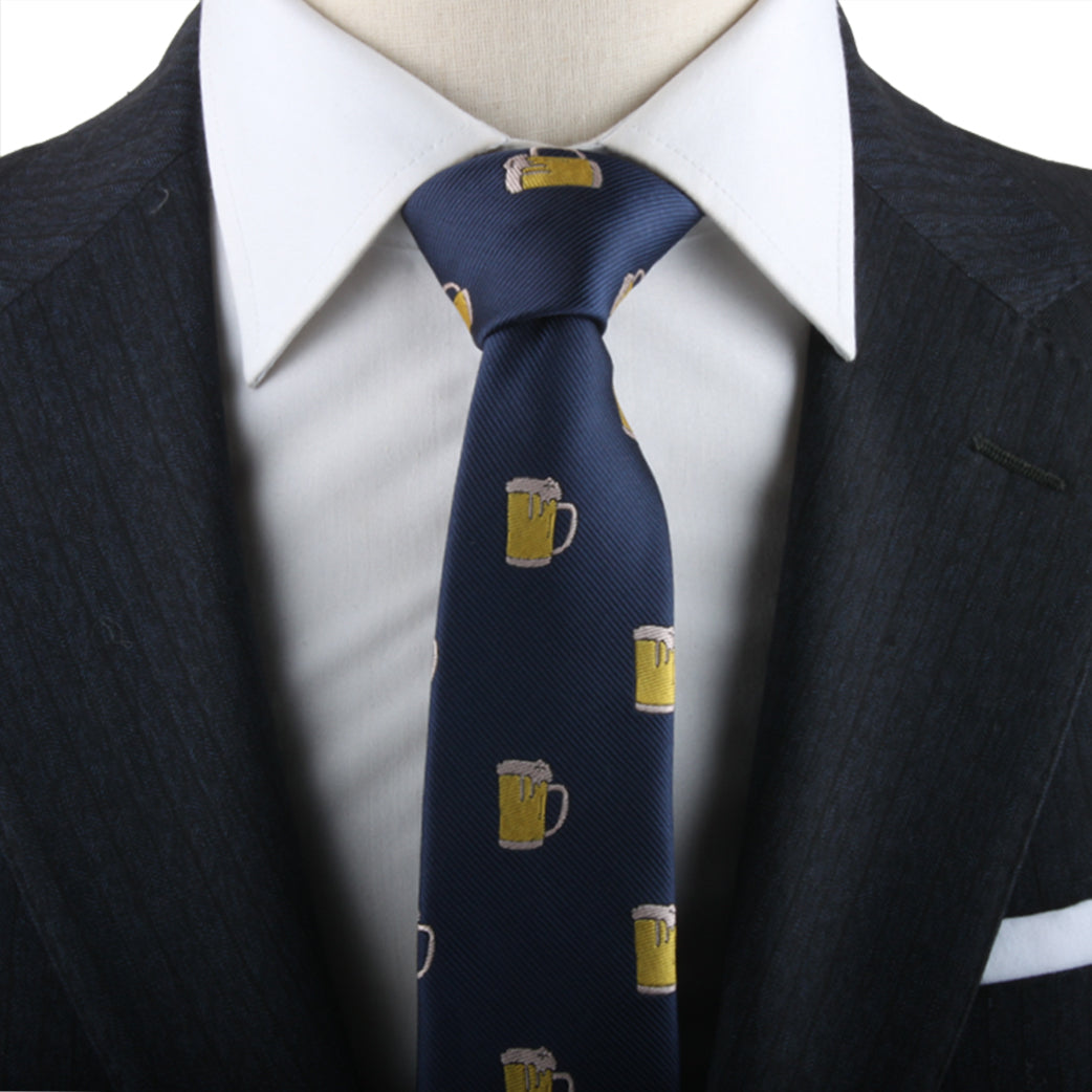 Close-up of a person wearing a dark pinstripe suit and white dress shirt, with a Beer Print Tie decorated with small beer mug images, capturing a sense of conviviality in modern style.