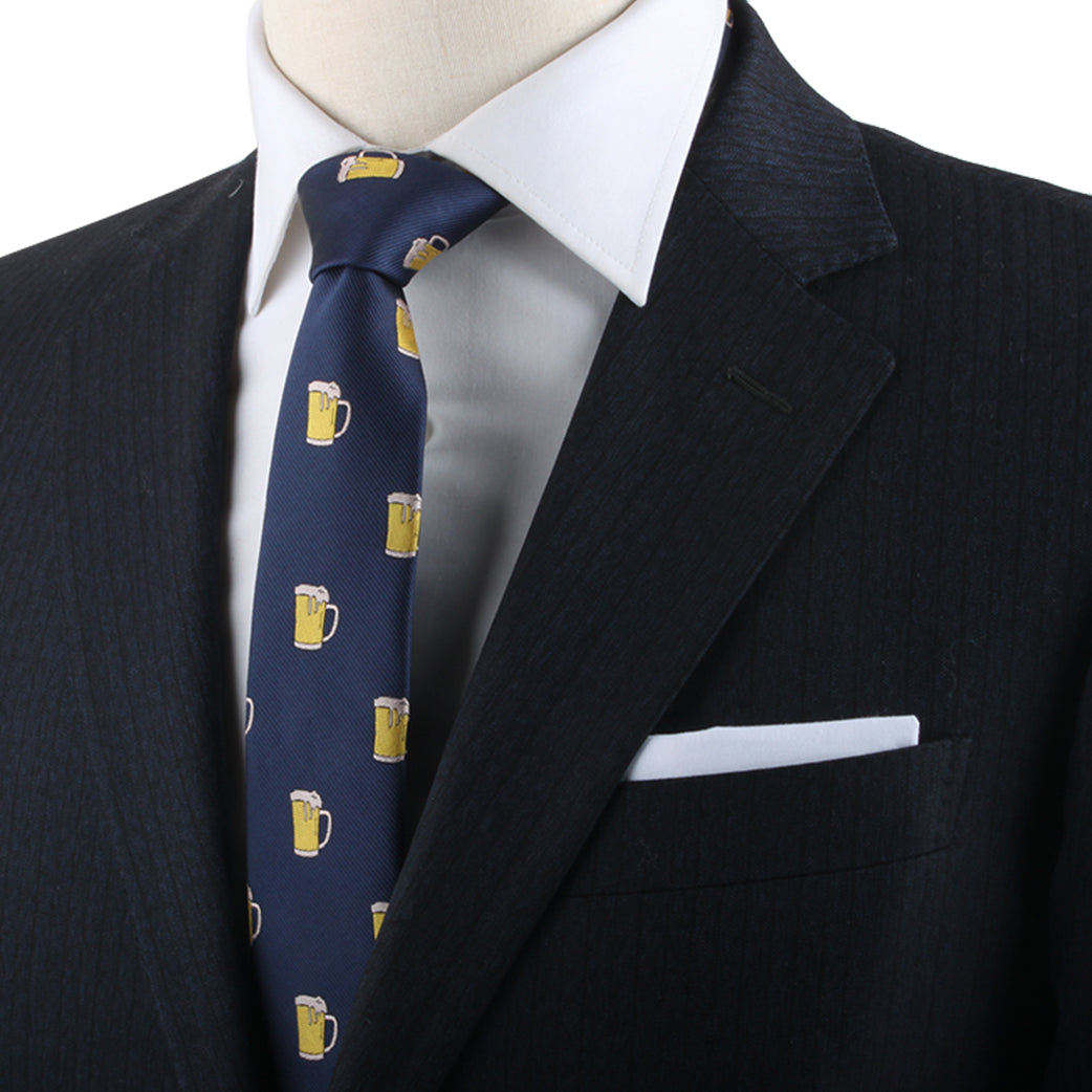 A person in a dark suit jacket and white dress shirt embodies modern style, accessorized with a Beer Themed Tie, reflecting an air of conviviality.